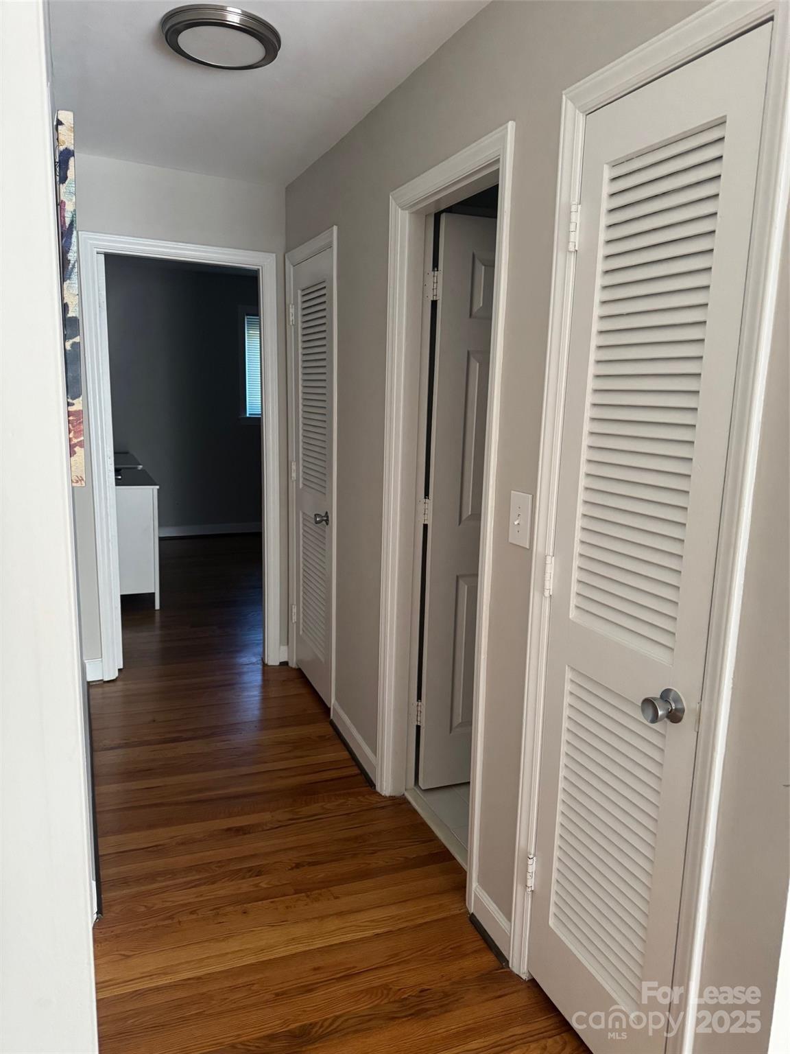 400 Queens Road Charlotte, NC 28207 - Photo 9 of 15 a view of a hallway with wooden floor and staircase