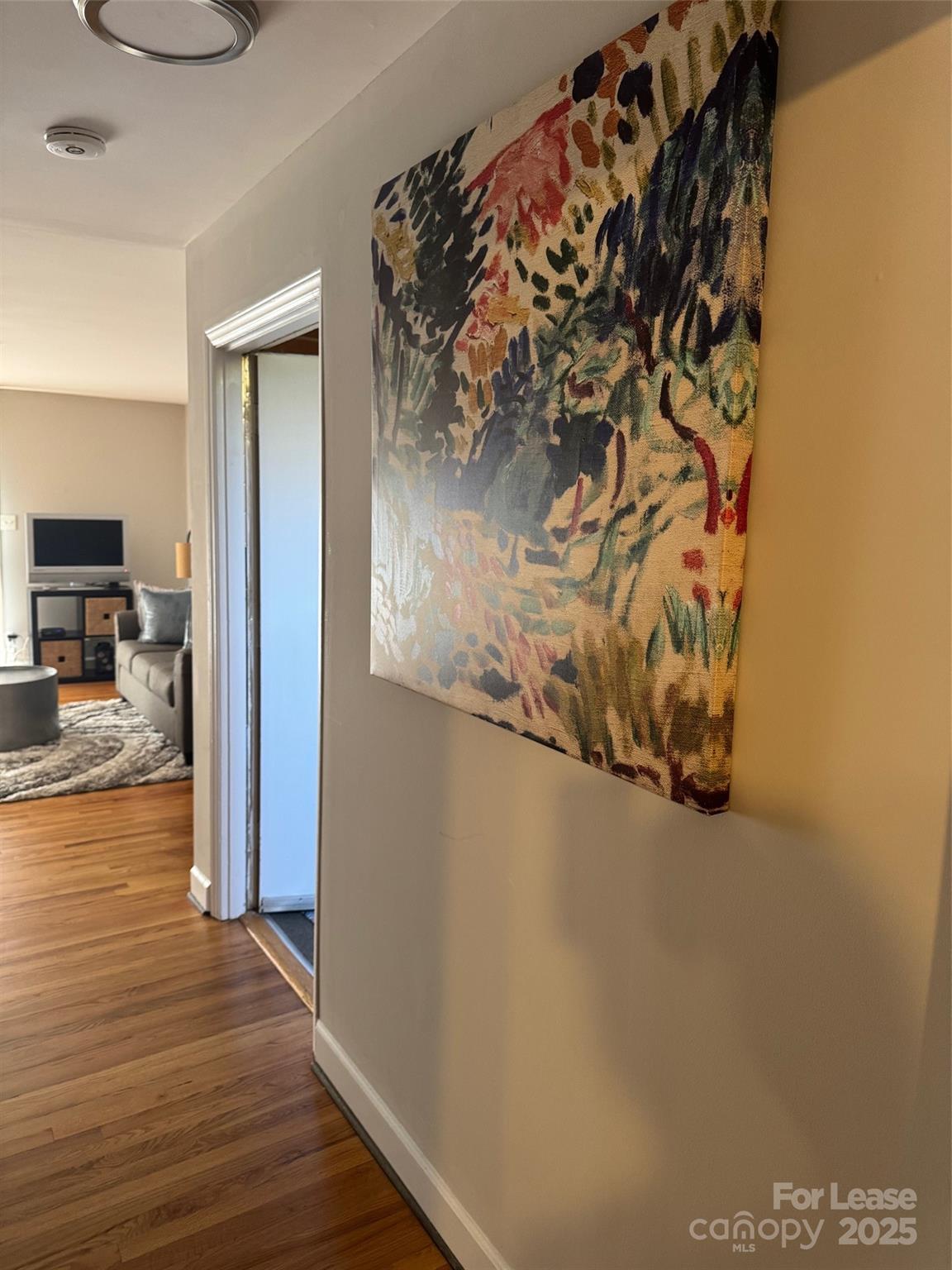 400 Queens Road Charlotte, NC 28207 - Photo 10 of 15 a view of a refrigerator in kitchen and wooden floor