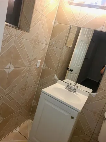 a bathroom with a sink and vanity