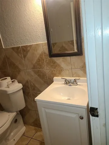 a bathroom with a sink and a toilet