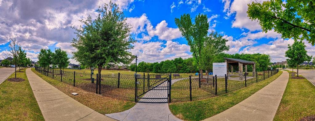 15018 Crape Myrtle Road Frisco, TX 75035 - Photo 38 of 40 Fenced community green space featuring a covered pavilion, walking paths, and mature trees