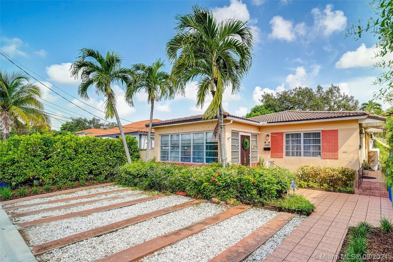 1431 Southwest 20th Street Miami, FL 33145 - Photo 1 of 32 a front view of a house with a garden
