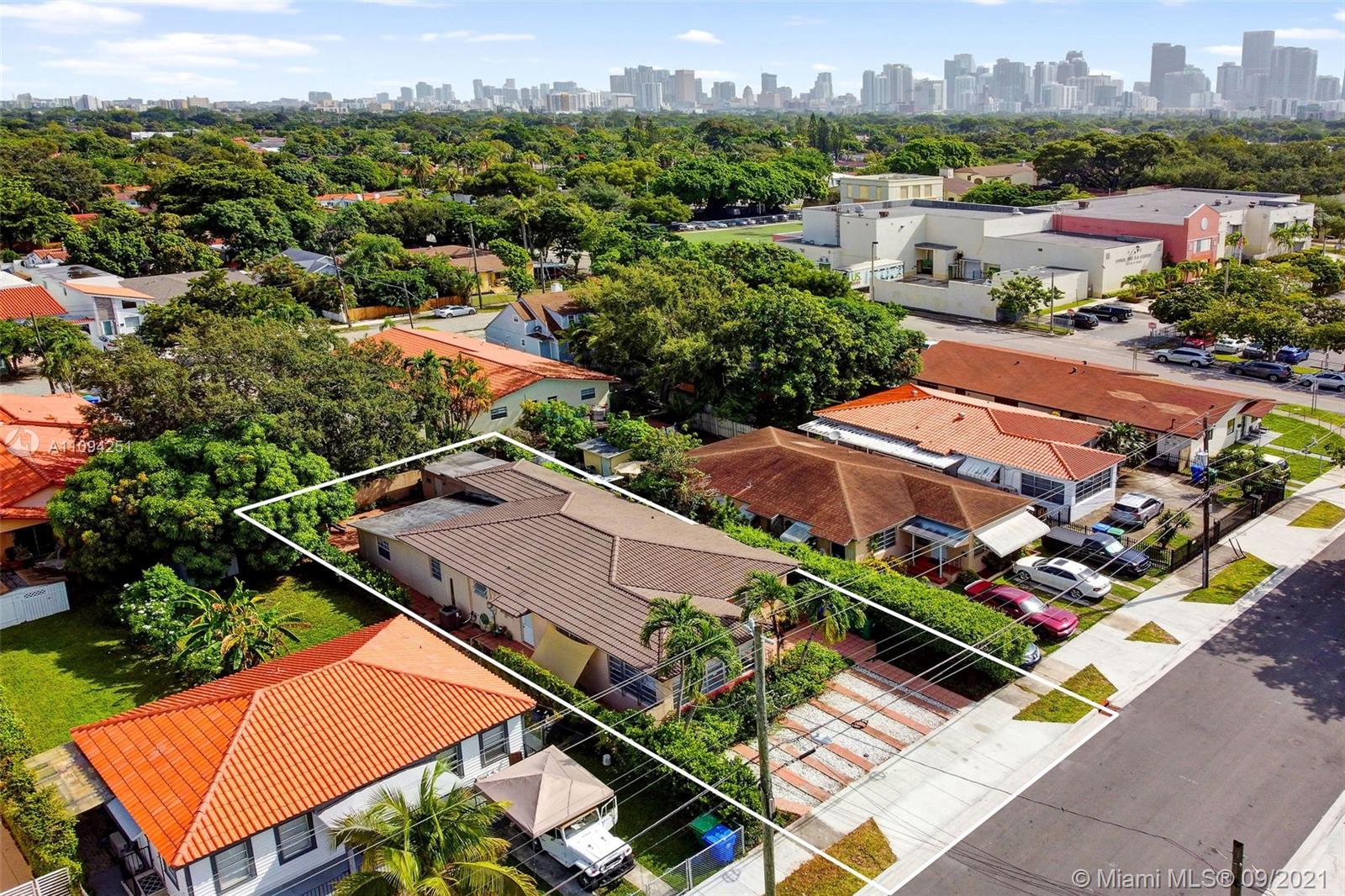 1431 Southwest 20th Street Miami, FL 33145 - Photo 2 of 32 an aerial view of an residential houses with a city street