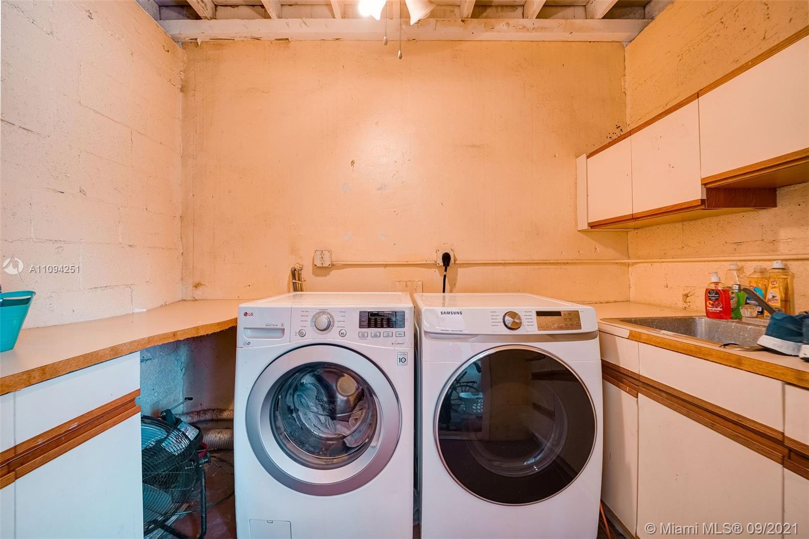 1431 Southwest 20th Street Miami, FL 33145 - Photo 22 of 32 a utility room with dryer and washer