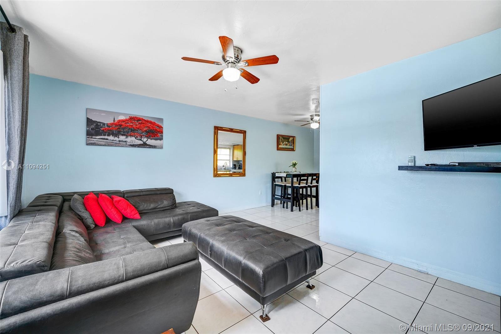 1431 Southwest 20th Street Miami, FL 33145 - Photo 24 of 32 a living room with furniture and a flat screen tv