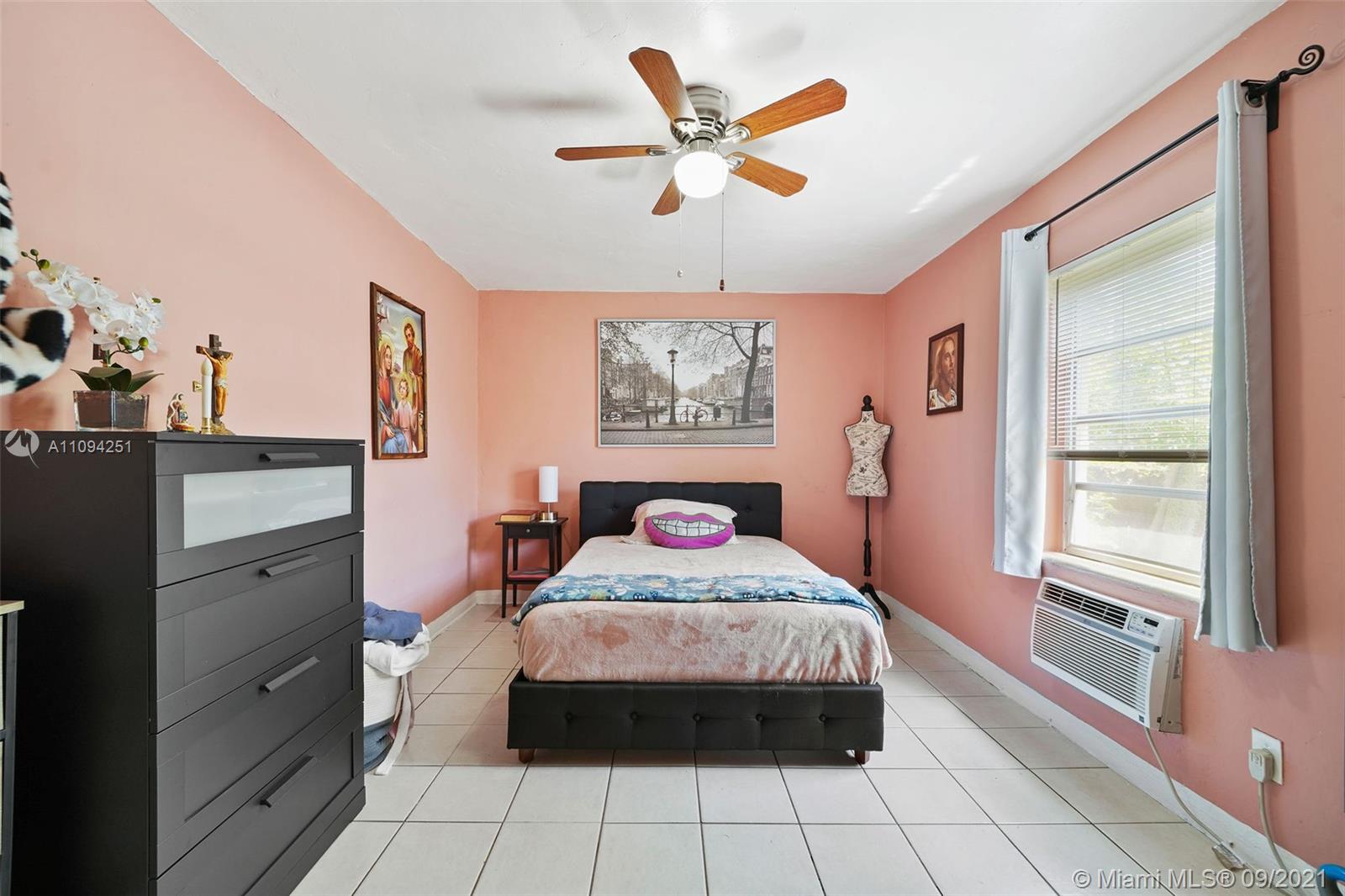 1431 Southwest 20th Street Miami, FL 33145 - Photo 28 of 32 a bedroom with a large bed and a window