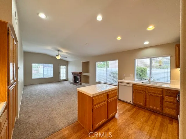 a kitchen with stainless steel appliances a refrigerator sink and stove