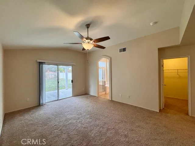 an empty room that has a window in it