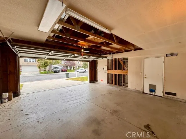 a view of a backyard with sitting area