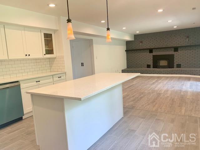 20 Sherwood Road Edison, NJ 08820 - Photo 13 of 26 a kitchen with kitchen island a sink stainless steel appliances and cabinets