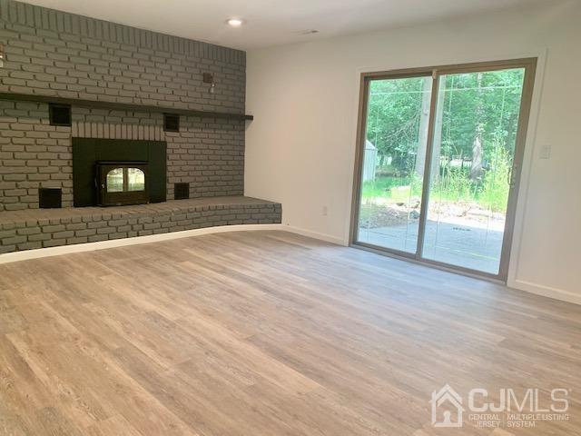 20 Sherwood Road Edison, NJ 08820 - Photo 14 of 26 a view of an empty room with wooden floor and a window