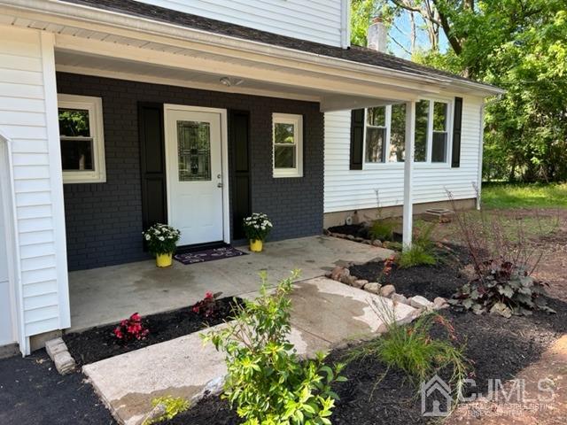 20 Sherwood Road Edison, NJ 08820 - Photo 2 of 26 a front view of a house with a yard