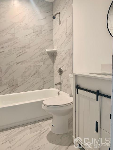 20 Sherwood Road Edison, NJ 08820 - Photo 25 of 26 a bathroom with a sink a toilet and shower