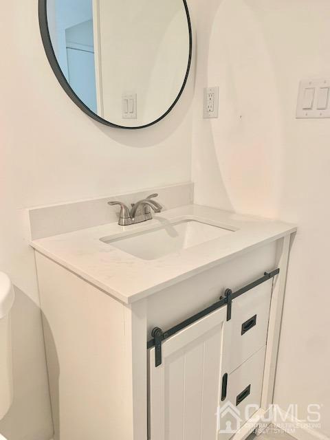 20 Sherwood Road Edison, NJ 08820 - Photo 26 of 26 a bathroom with a sink and a mirror