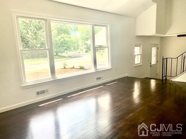 20 Sherwood Road Edison, NJ 08820 - Photo 6 of 26 a view of an empty room with wooden floor and a window
