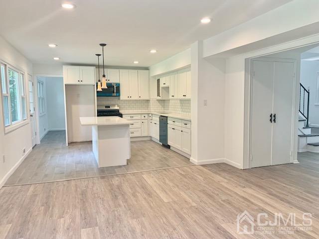 20 Sherwood Road Edison, NJ 08820 - Photo 10 of 26 a view of kitchen with wooden floor and window