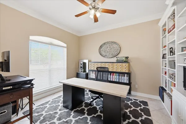 a bedroom with furniture and a window