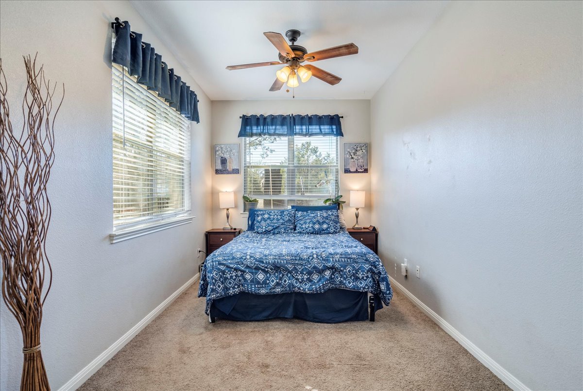 11 Rhapsody Lane Wimberley, TX 78676 - Photo 13 of 35 a bedroom with a bed and window