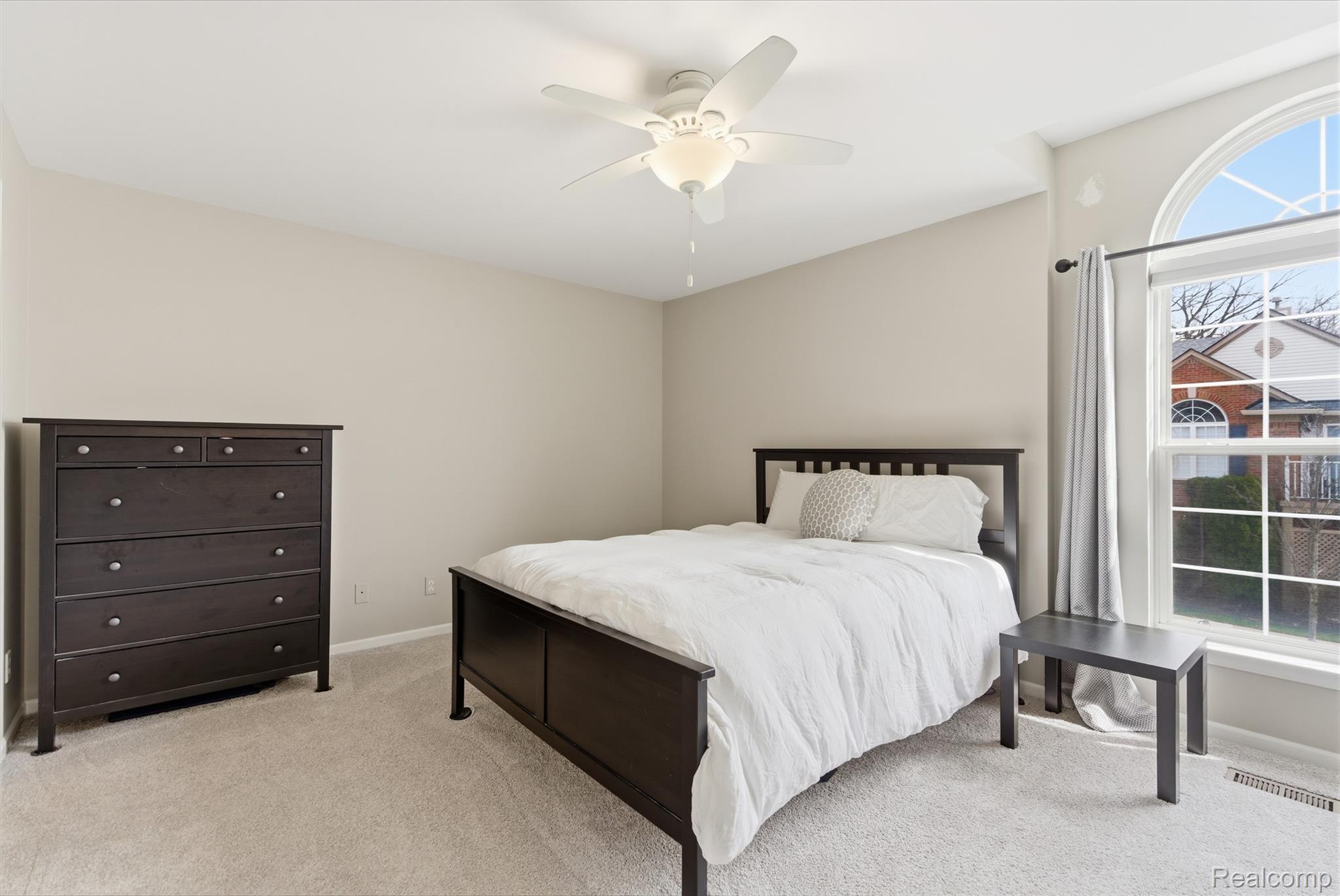 3402 Tremonte Circle Rochester, MI 48306 - Photo 14 of 37 Bedroom featuring light carpet and a ceiling fan