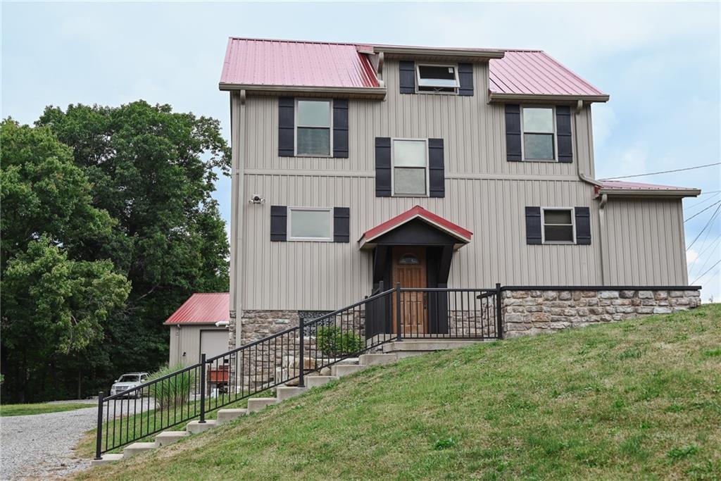 447 Rte 422 Butler, PA 16002 - Photo 1 of 32 a front view of a house with garden