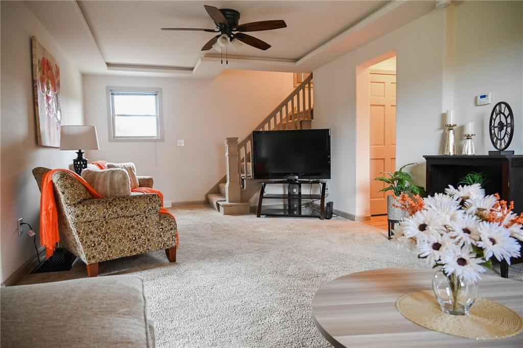 447 Rte 422 Butler, PA 16002 - Photo 12 of 32 a living room with furniture and a flat screen tv