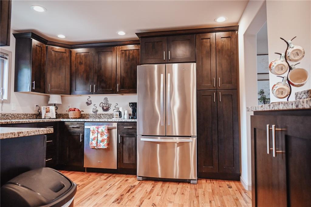 447 Rte 422 Butler, PA 16002 - Photo 13 of 32 a kitchen with stainless steel appliances granite countertop a refrigerator a sink and wooden cabinets