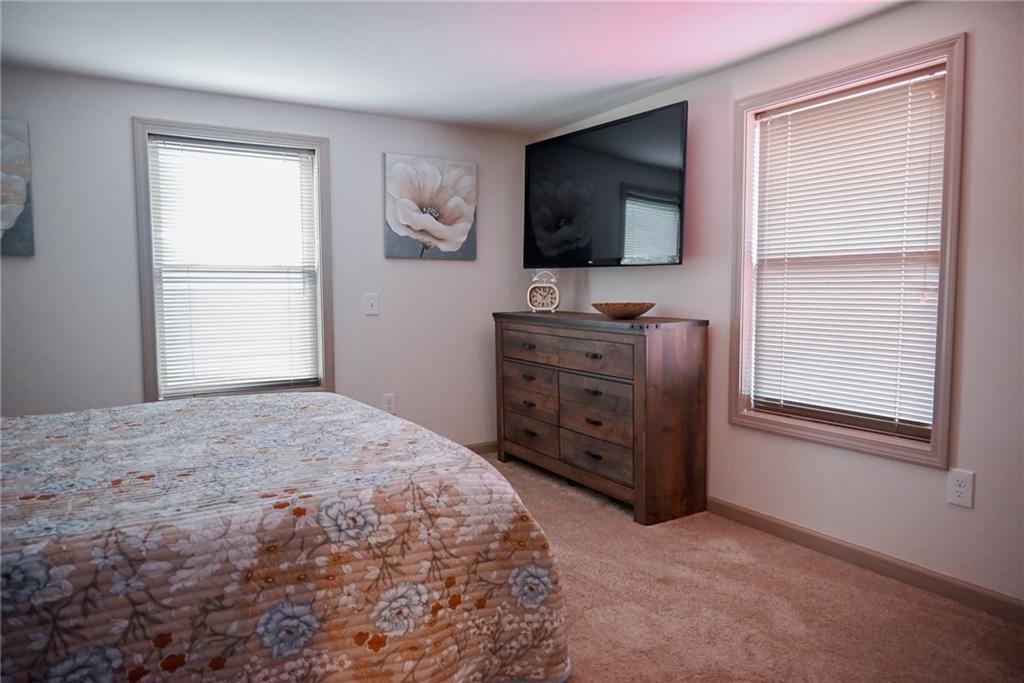 447 Rte 422 Butler, PA 16002 - Photo 21 of 32 a bedroom with a bed and flat screen tv