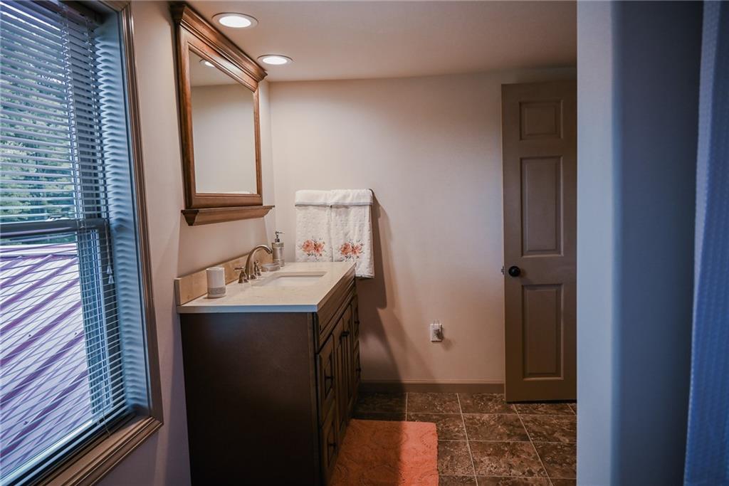 447 Rte 422 Butler, PA 16002 - Photo 23 of 32 a bathroom with a sink and mirror