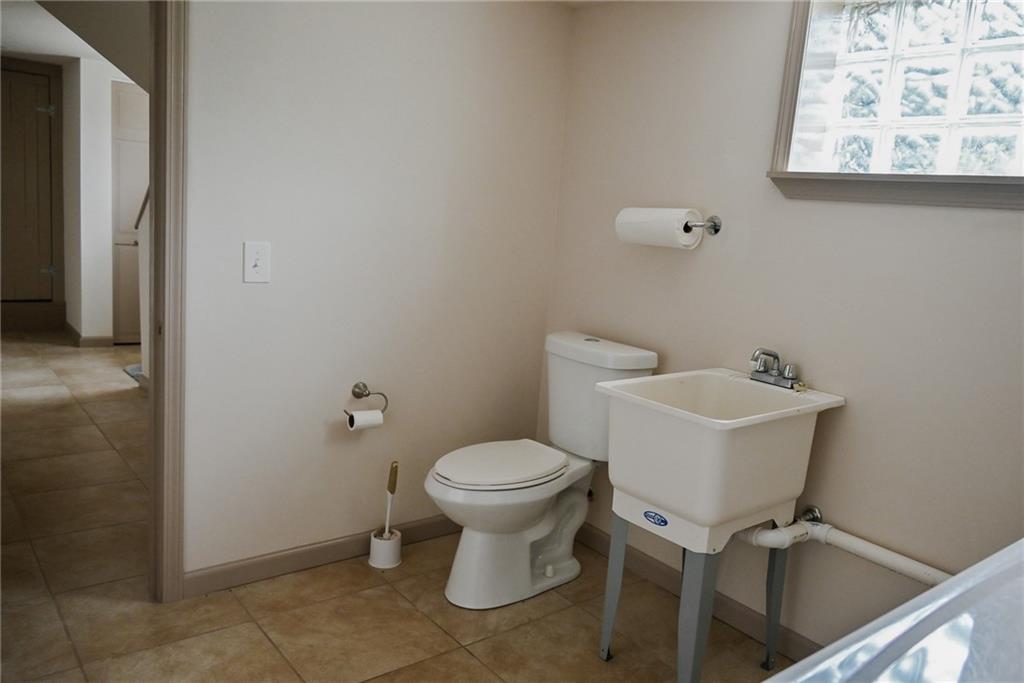 447 Rte 422 Butler, PA 16002 - Photo 27 of 32 a bathroom with a sink toilet and a mirror