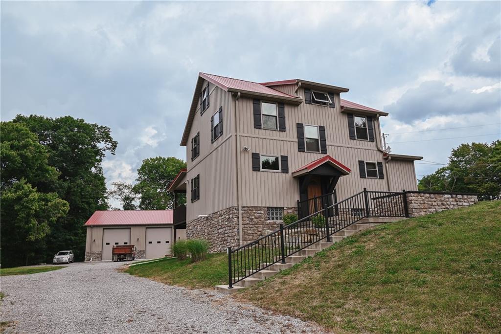 447 Rte 422 Butler, PA 16002 - Photo 3 of 32 a front view of a house with garden