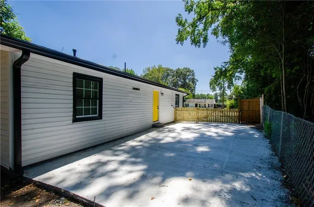 a backyard of a house with lots of green space