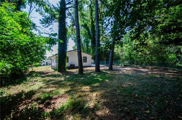 a view of backyard with green space