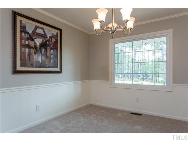 7929 Secluded Acres Road Apex, NC 27523 - Photo 11 of 16 The dining room has plenty of space for large family dinners or entertaining guests.