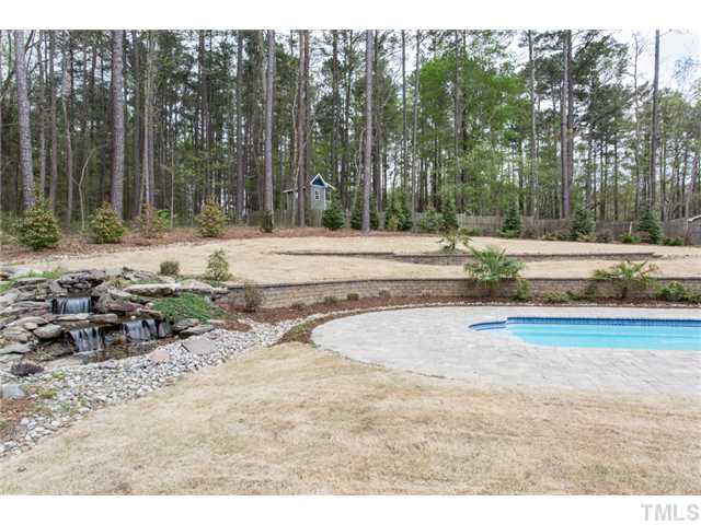 7929 Secluded Acres Road Apex, NC 27523 - Photo 14 of 16 Another view of the yard, the retaining walls and beautiful landscaping.
