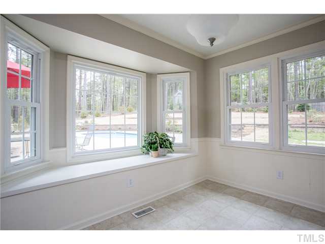 7929 Secluded Acres Road Apex, NC 27523 - Photo 6 of 16 The breakfast room has a window seat and a great view of the back yard - your very own "vacation" spot! There are a lot of windows throughout the home that let in so much natural light.