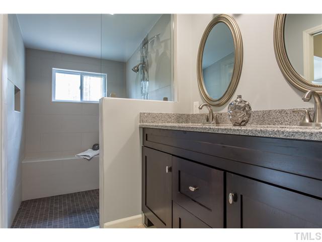 7929 Secluded Acres Road Apex, NC 27523 - Photo 9 of 16 The master bath also features dual vanities, new tile flooring and new vanity with GRANITE top.