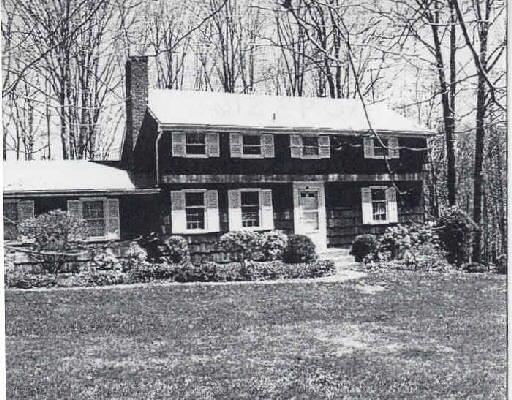 20 Mead Ridge Lane Ridgefield, CT 06877 - Photo 1 of 1 a front view of a house with garden