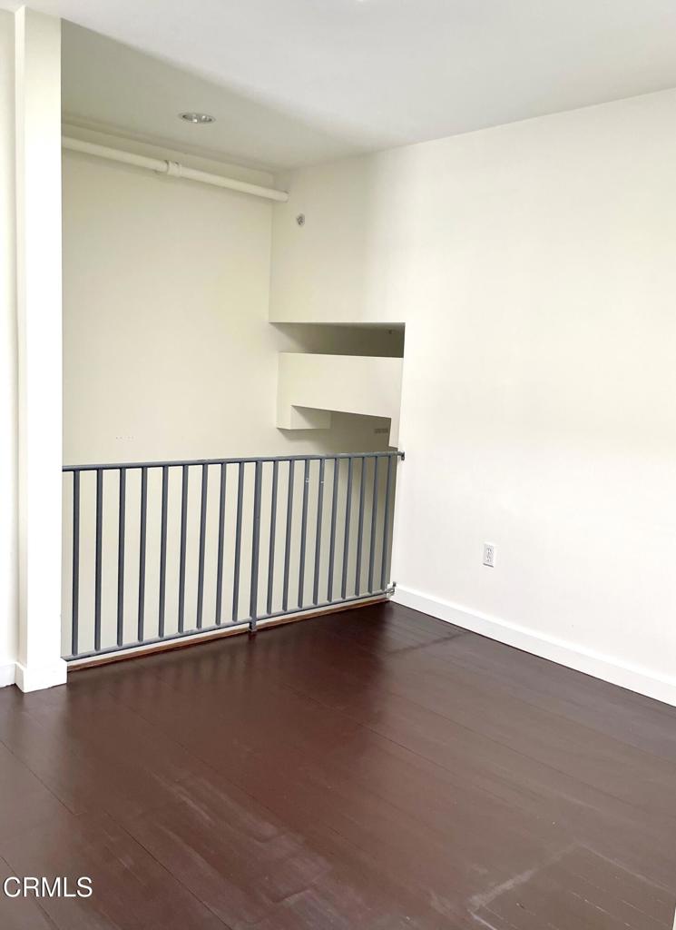 257 South Spring Street, Unit PHE Los Angeles, CA 90012 - Photo 22 of 32 a view of a room with wooden floor
