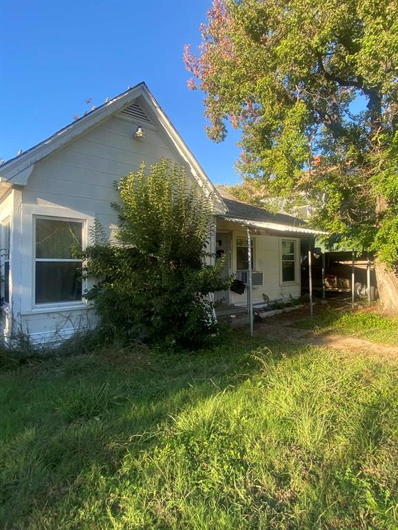 3103 Homan Avenue Waco, TX 76707 - Photo 2 of 4 a front view of a house with a garden