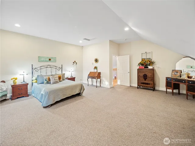 a bedroom with furniture and a chandelier