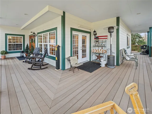 a living room with furniture fireplace and wooden floor