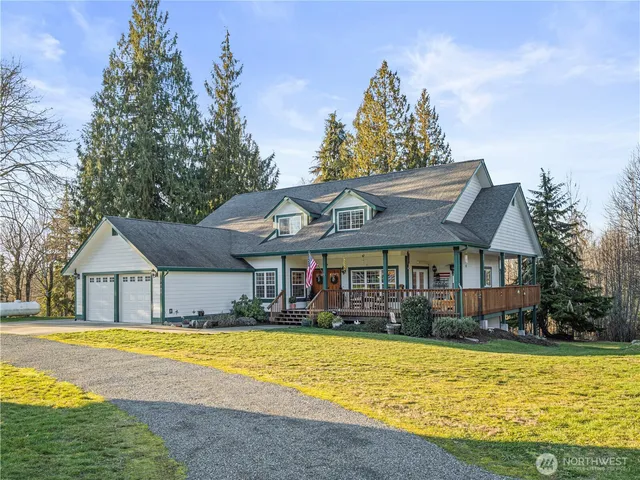 a front view of a house with swimming pool having outdoor seating