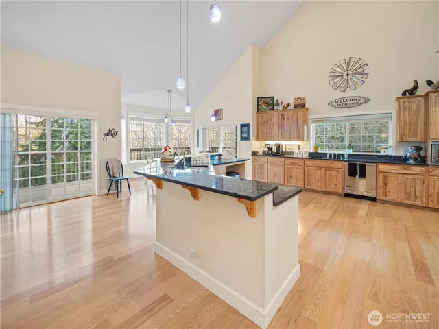 a large kitchen with lots of counter space and stainless steel appliances