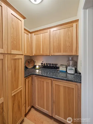 a kitchen with a window a sink and a cabinets