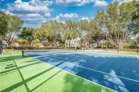a view of an outdoor space and tennis court
