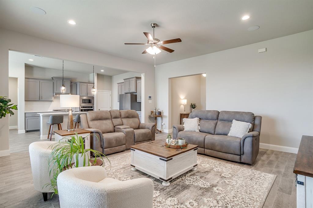 10108 Walnut Rdg Drive Grand Prairie, TX 76065 - Photo 2 of 21 a living room with furniture and kitchen view