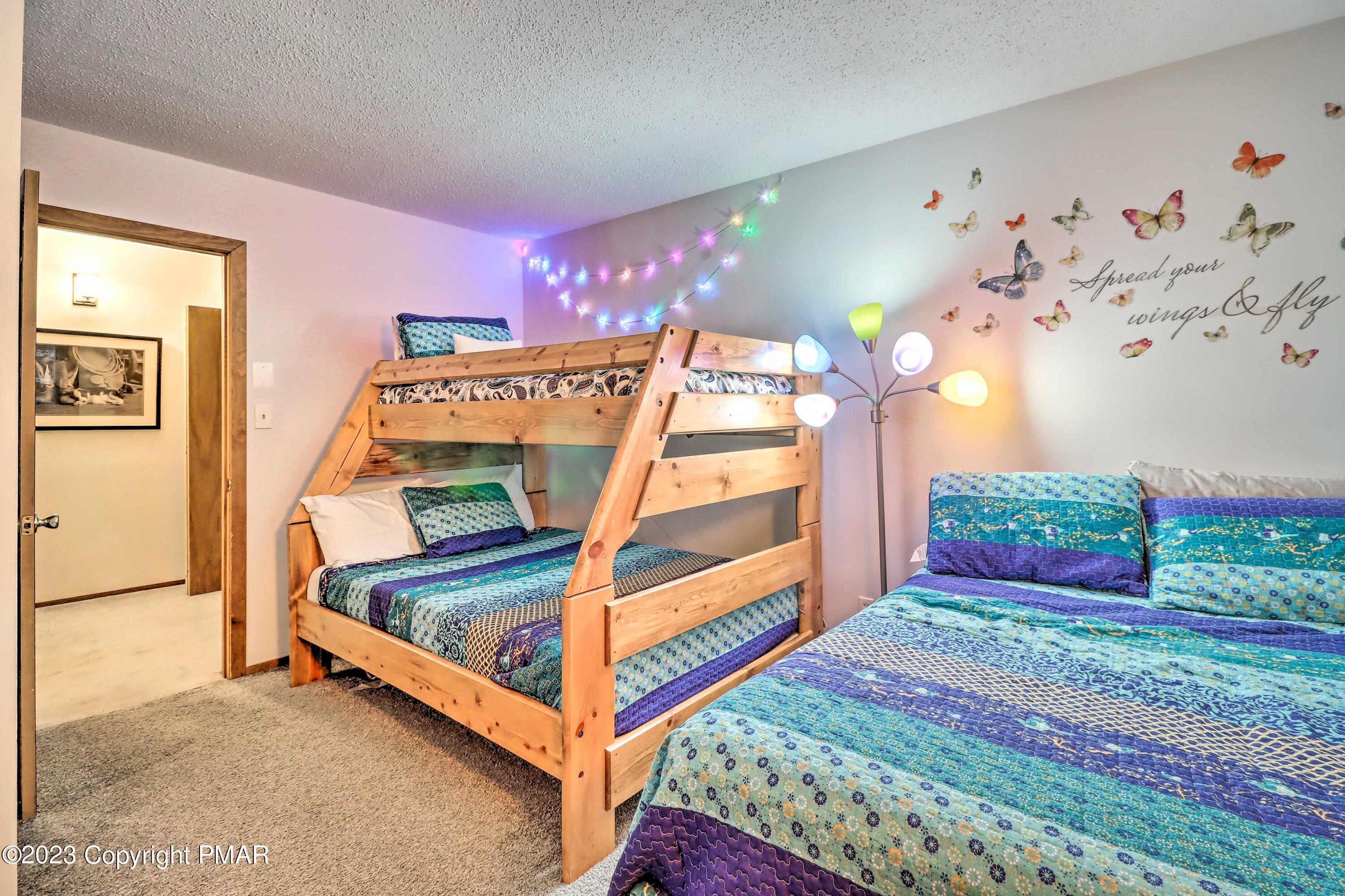 296 Overlook Way Tannersville, PA 18372 - Photo 15 of 44 a bedroom with a bed and a chandelier