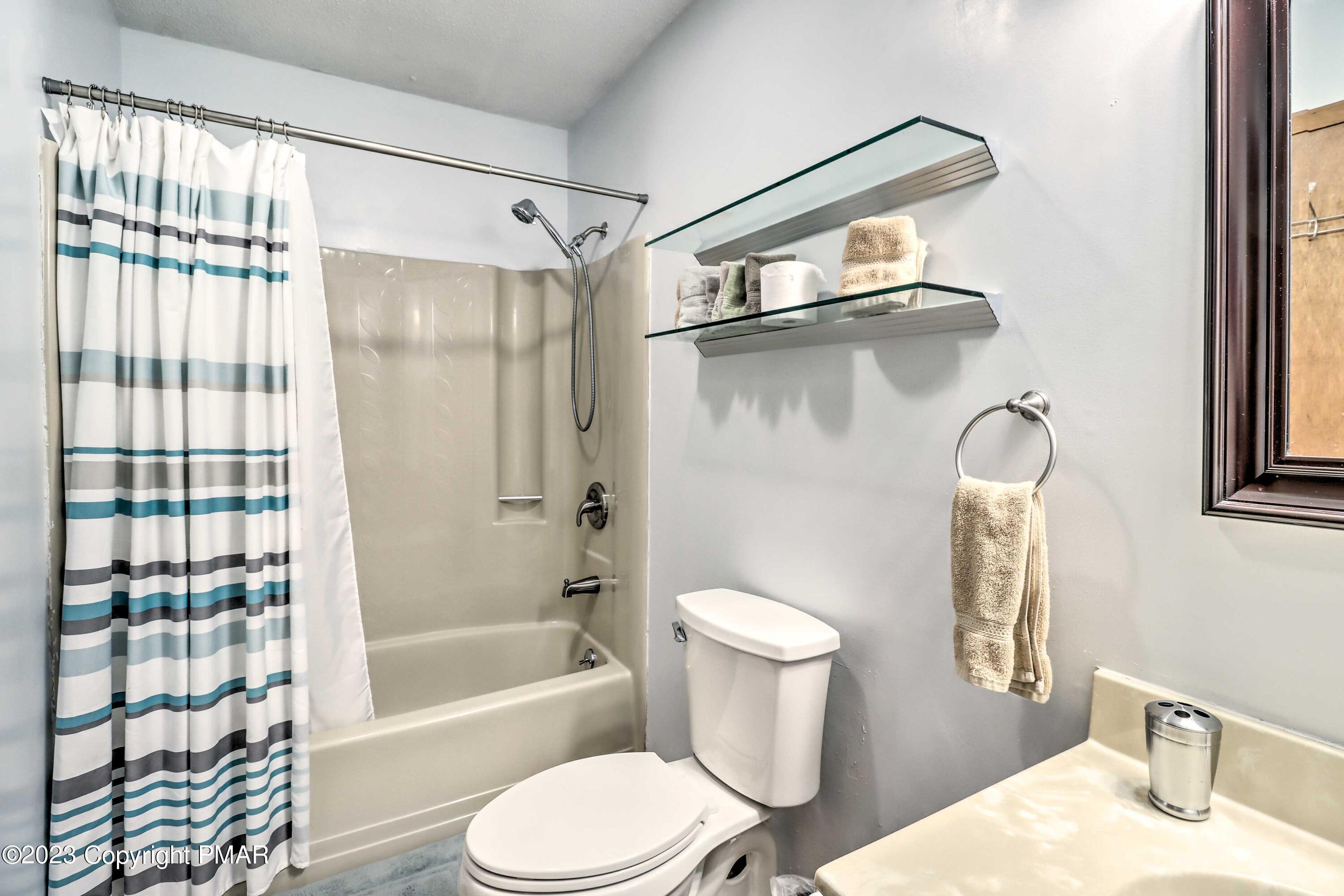 296 Overlook Way Tannersville, PA 18372 - Photo 17 of 44 a bathroom with a toilet sink and shower