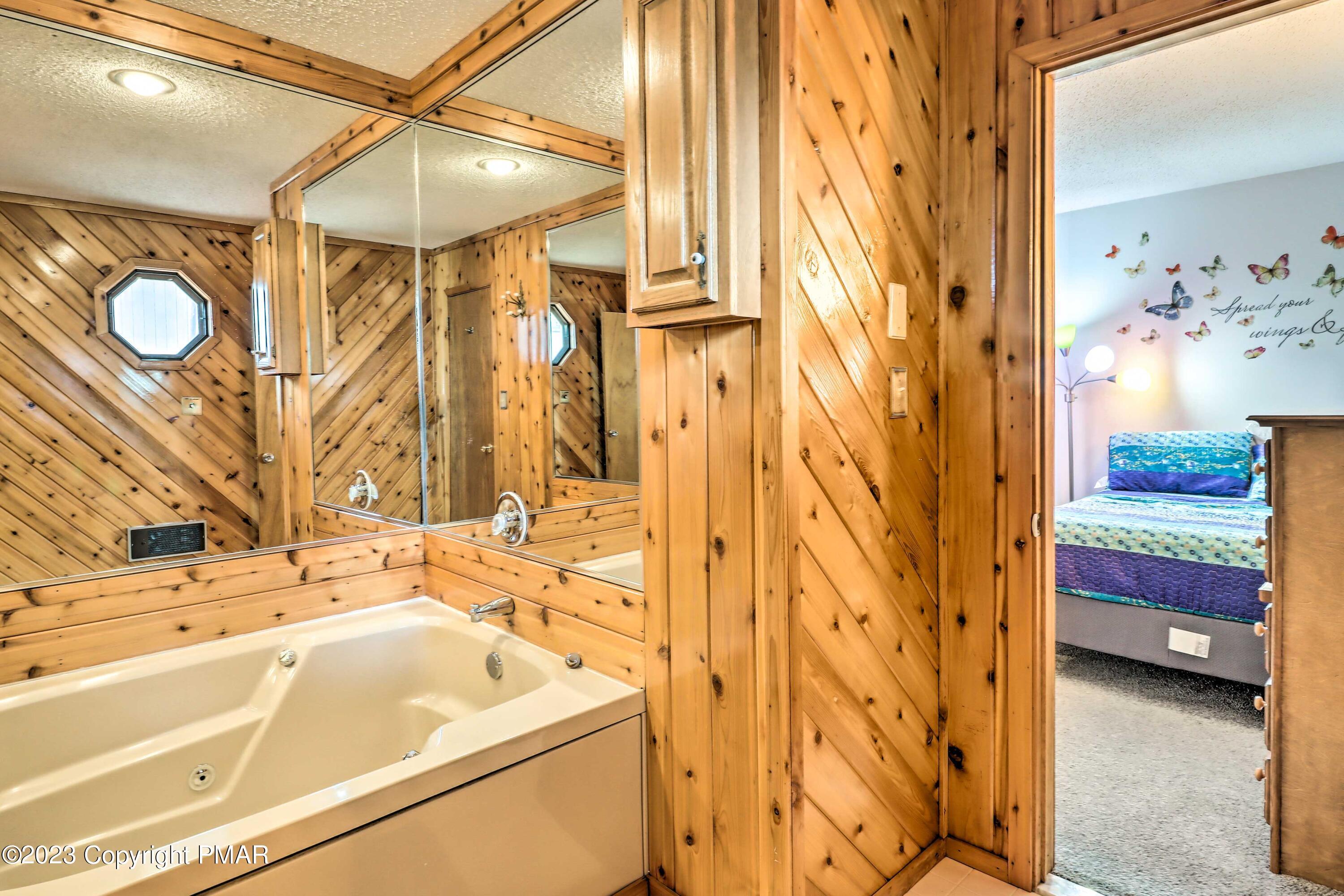 296 Overlook Way Tannersville, PA 18372 - Photo 18 of 44 a bathroom with a tub a sink and a shower