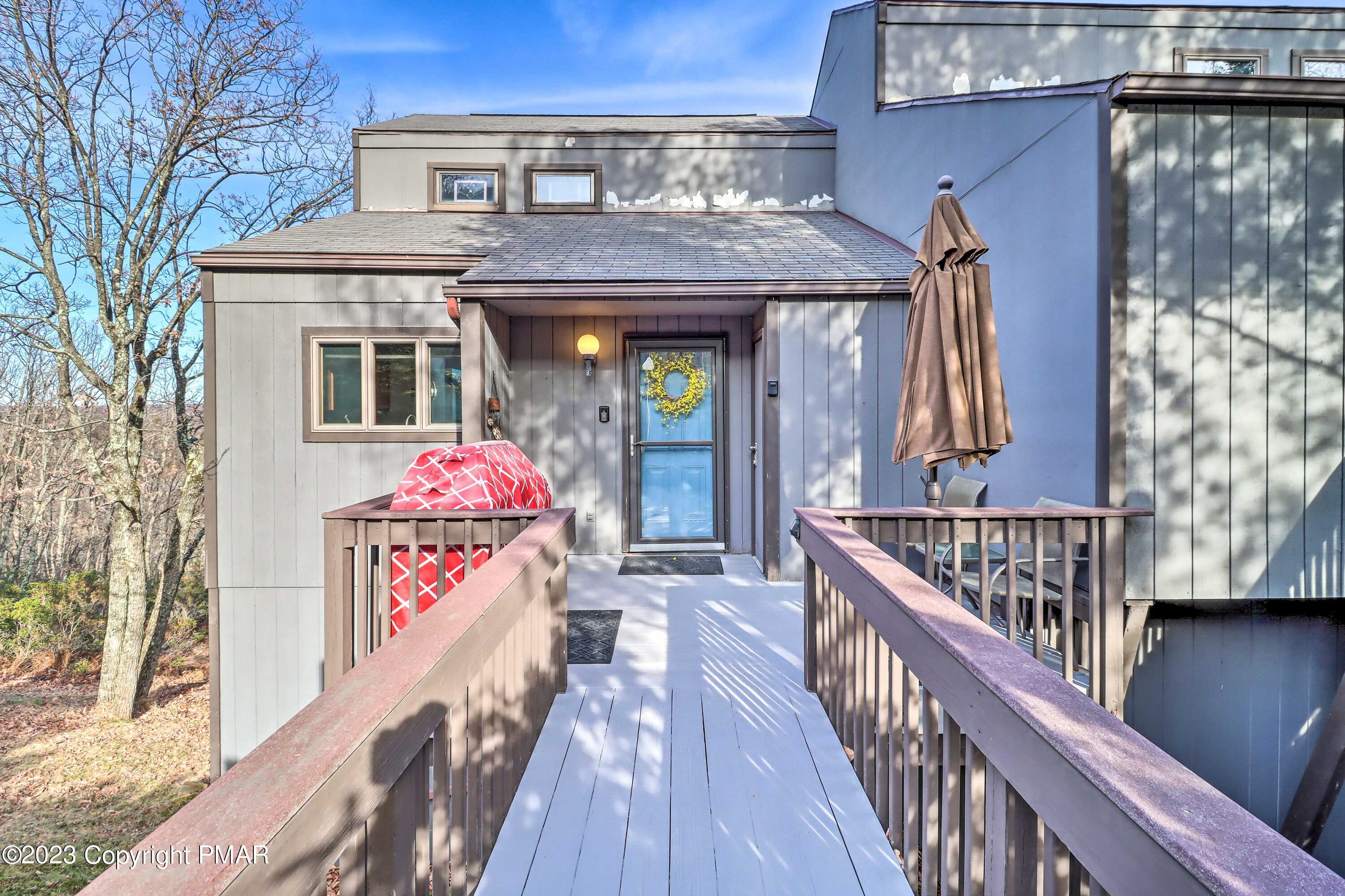 296 Overlook Way Tannersville, PA 18372 - Photo 2 of 44 a front view of a house with wooden deck
